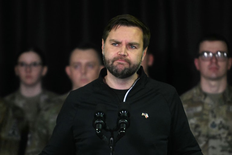 JD Vance frowns while speaking at a press conference in Greenland.
