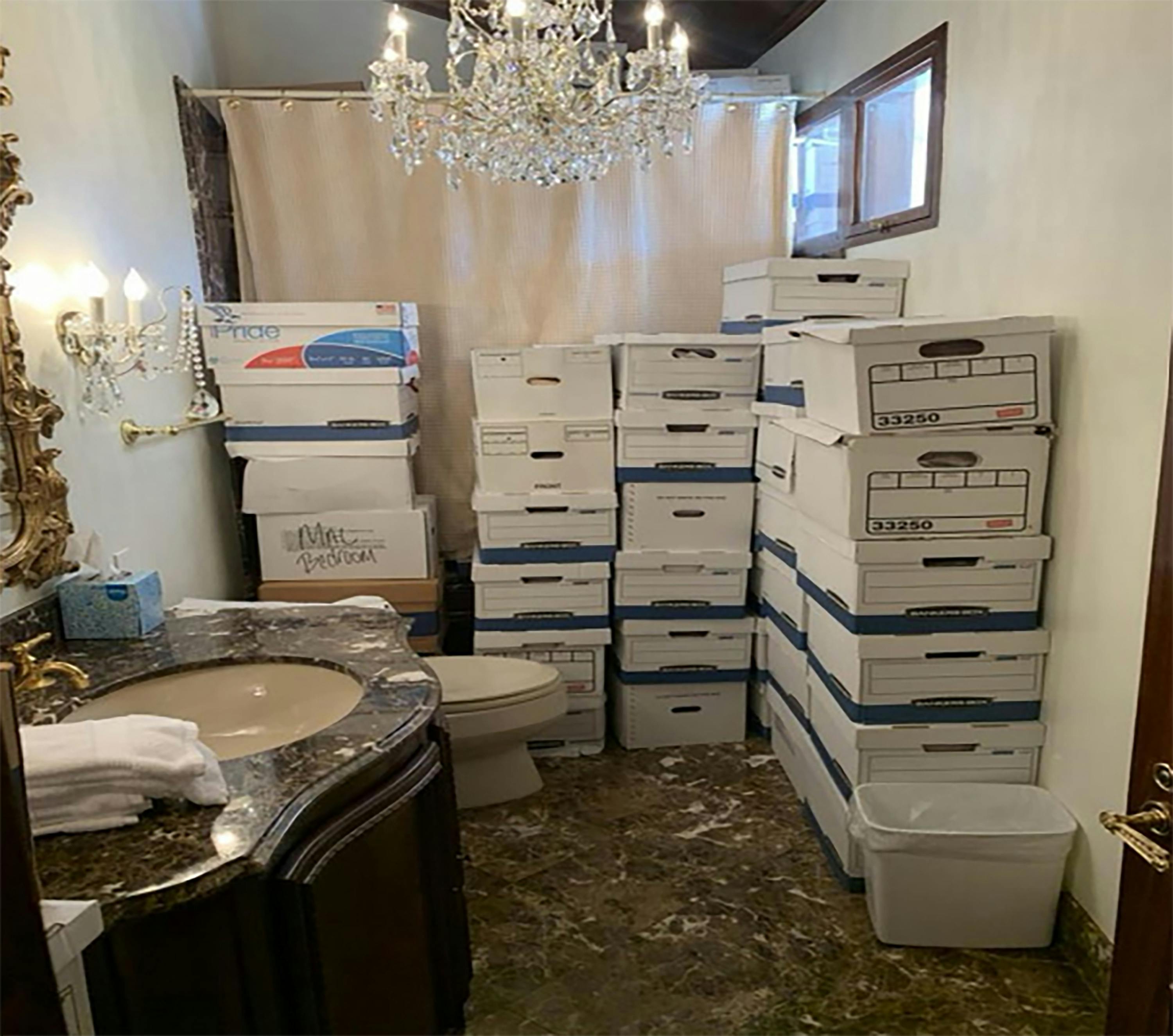 Piles of boxes with classified documents in the gaudy bathroom at Mar-a-Lago.