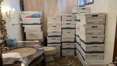 Piles of boxes with classified documents in the gaudy bathroom at Mar-a-Lago.