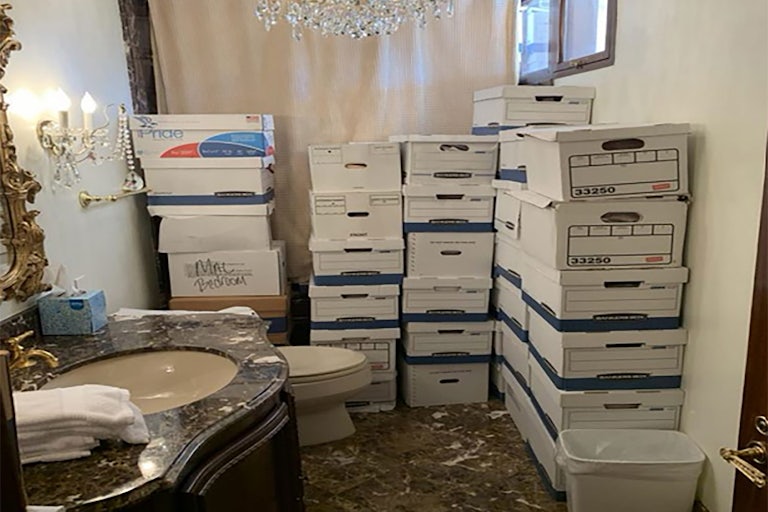 Piles of boxes with classified documents in the gaudy bathroom at Mar-a-Lago.