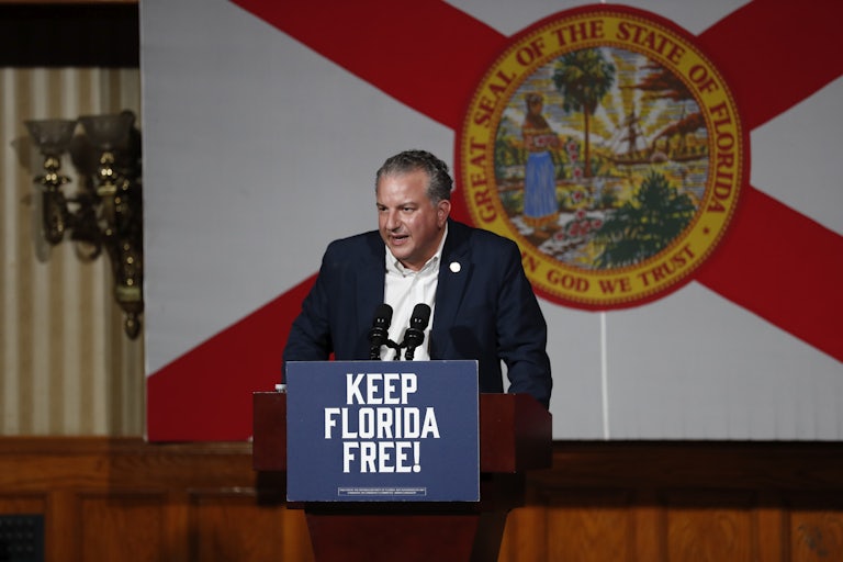 Jimmy Patronis speaks at a lectern that reads "Keep Florida Free"