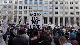 An activist holds a sign reading “Abolish ICE for Good” during a march to the headquarters of U.S. Immigration and Customs Enforcement in Washington, D.C.