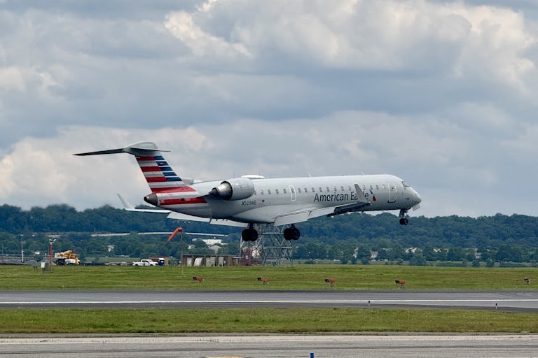 AnAmerican Eagle plane takes off at an airport.