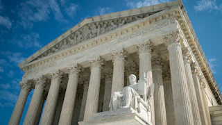 The Guardian or Authority of Law, created by sculptor James Earle Fraser, rests on the side of the U.S. Supreme Court.