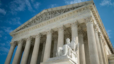 The Guardian or Authority of Law, created by sculptor James Earle Fraser, rests on the side of the U.S. Supreme Court.