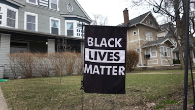 Black Lives Matter sign in someone's front lawn