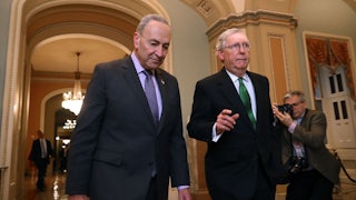 Senate Majority Leader Chuck Schumer and Senate Minority Leader Mitch McConnell stroll together through the halls of Capitol Hill