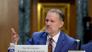 Trade Ambassador Jamieson Greer gestures while speaking during a Senate committee hearing.