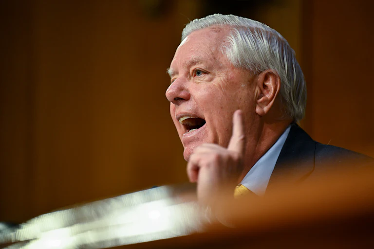Senator Lindsey Graham raises a finger while speaking during a hearing