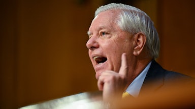 Senator Lindsey Graham raises a finger while speaking during a hearing