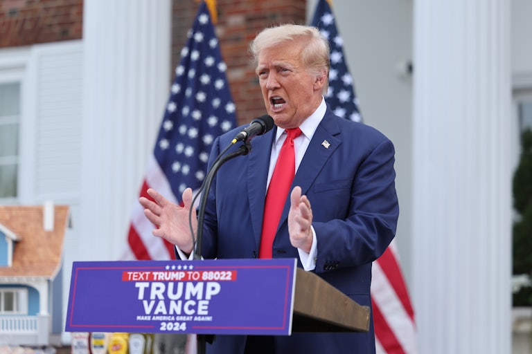 Donald Trump gestures while speaking during a press conference
