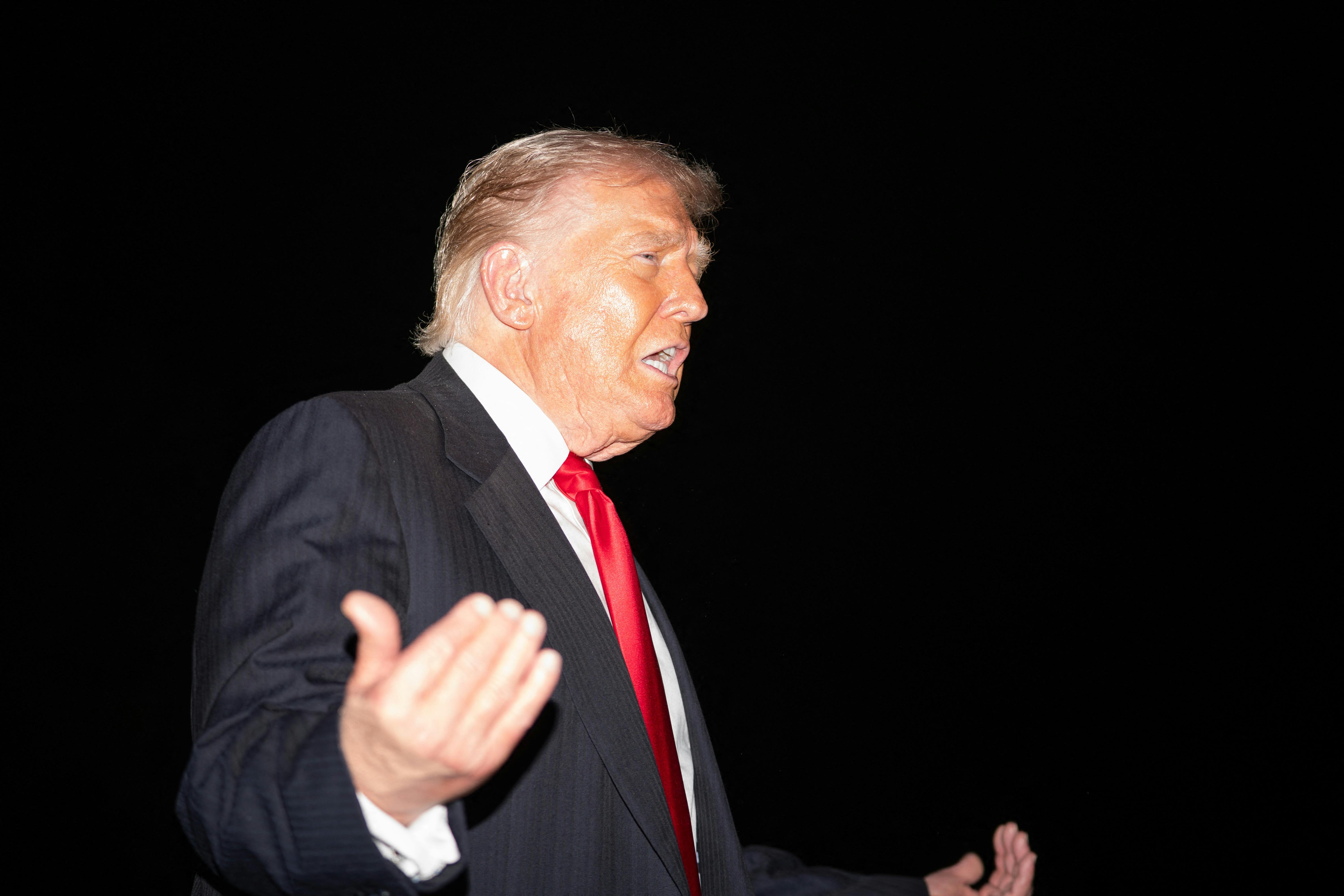 Donald Trump gestures while speaking