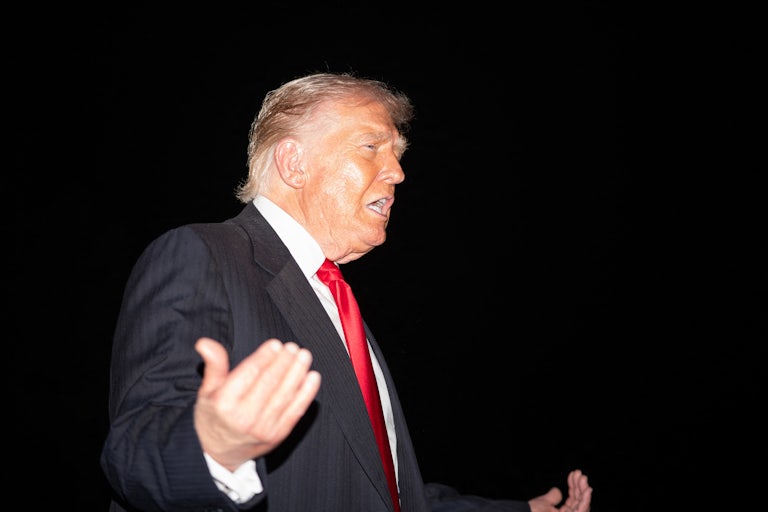 Donald Trump gestures while speaking