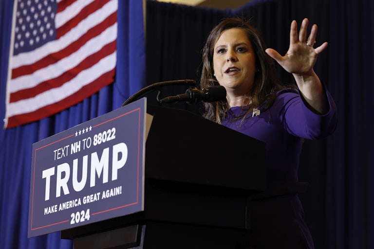 Elise Stefanik gestures while speaking at a podium