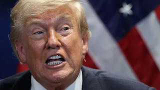 Donald Trump speaks during a press conference at a NATO summit