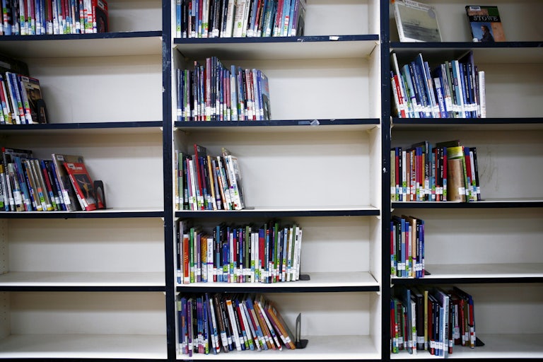 Bookshelves at a junior high school in South Carolina are half-empty