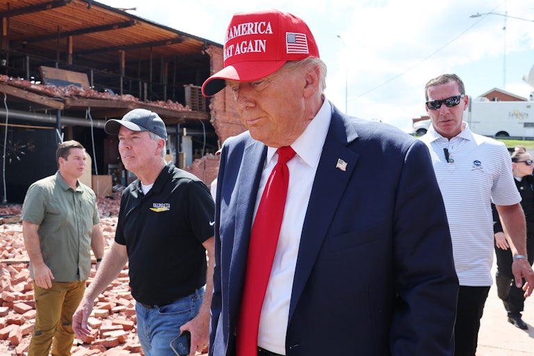 Donald Trump walks after a Hurricane Helene speech