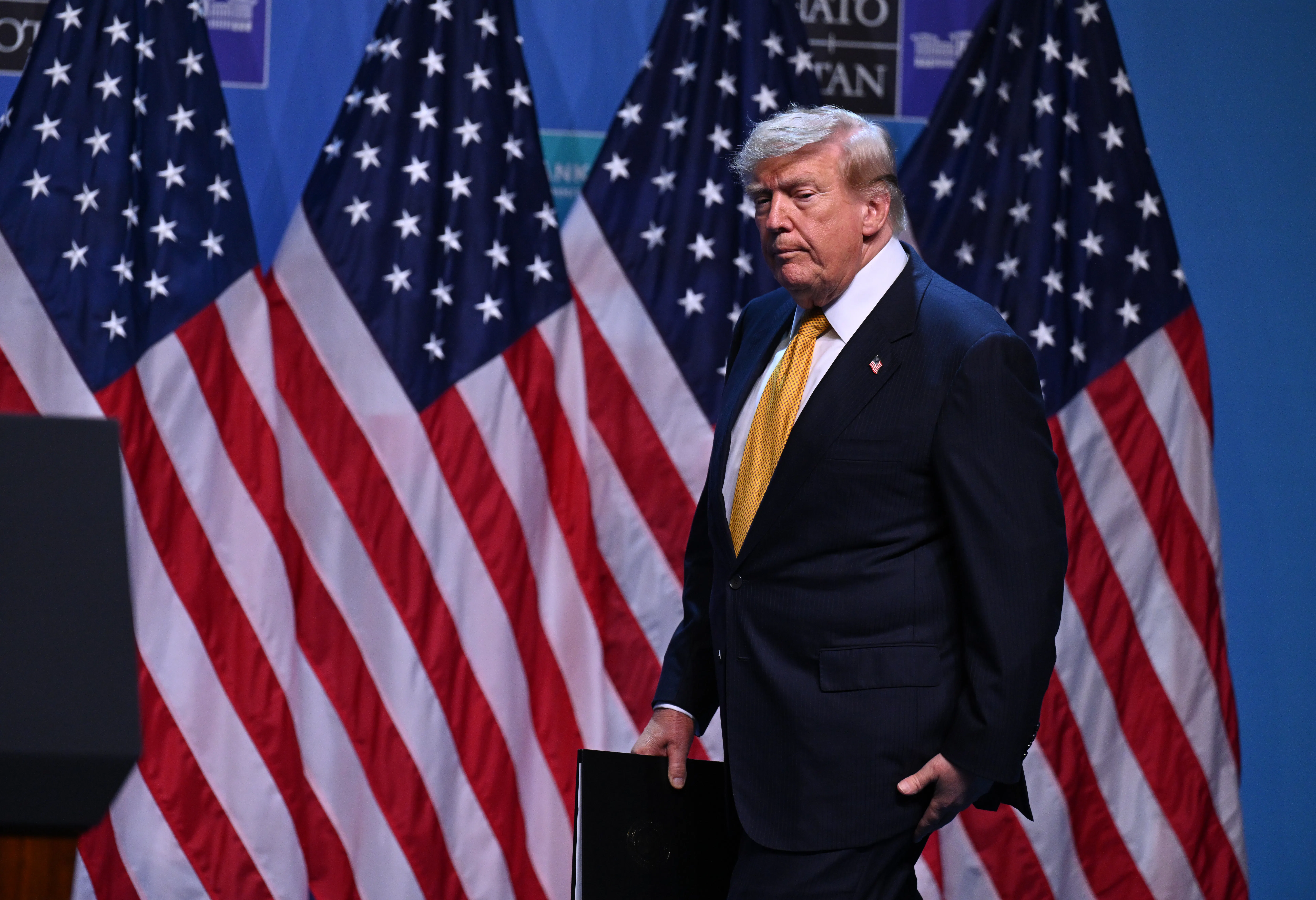 Donald Trump walks onstage ahead of a press conference at the NATO summit in Ankara, Turkey.