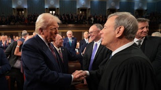 President Donald Trump greets Chief Justice John Roberts.