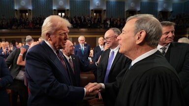 President Donald Trump greets Chief Justice John Roberts.