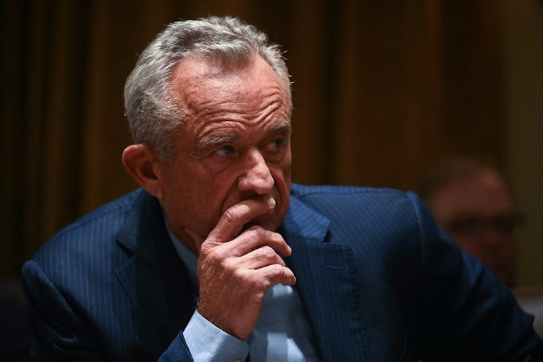 Robert F. Kennedy Jr. holds his hand up to his face during Donald Trump’s cabinet meeting