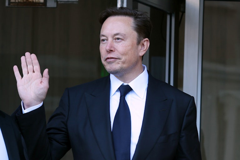 Elon Musk waves