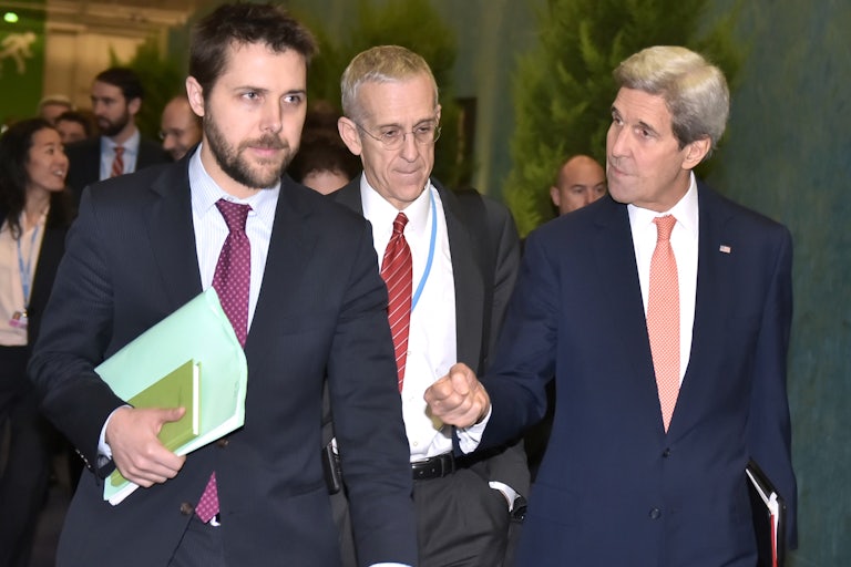 Brian Deese walks with then-Secretary of State John Kerry in 2015.