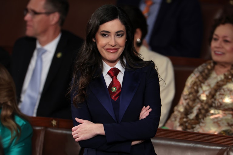 Representative Anna Paulina Luna smiles and folds her arms