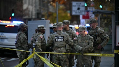 Six National Guard soldiers gather near the crime scene after a shooting in downtown Washington, D.C.