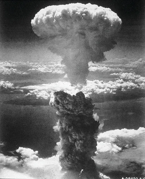 The massive mushroom cloud rising over Nagasaki, Japan, following the detonation of the atomic bomb 