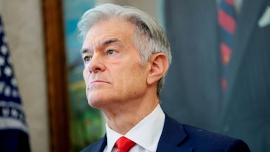 Mehmet Oz stands in the Oval Office