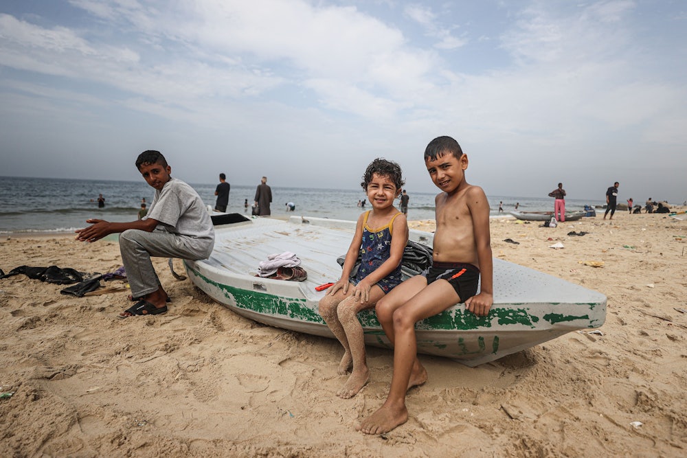 Palestinians at the beach in Deir al-Balah, Gaza