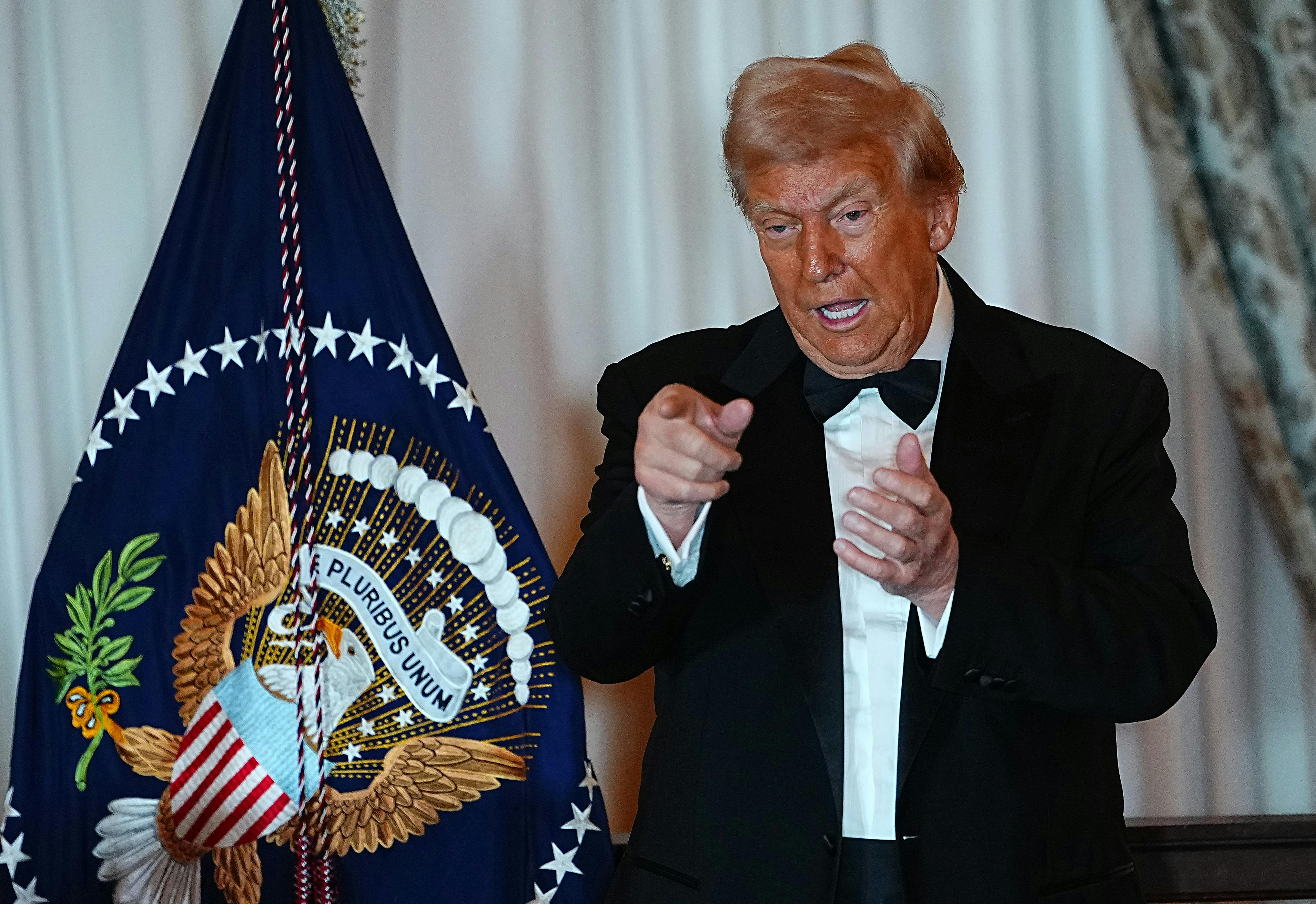 Donald Trump gestures after delivering remarks at the State Department Kennedy Center Honors medal presentation.