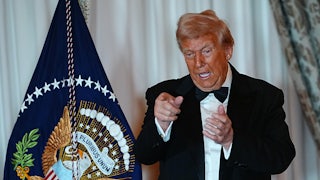 Donald Trump gestures after delivering remarks at the State Department Kennedy Center Honors medal presentation.
