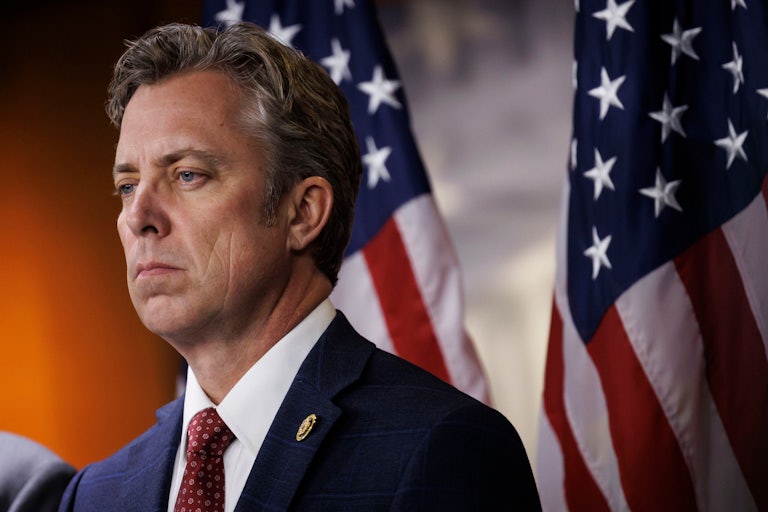 Representative Andy Ogles stares off intot he distance