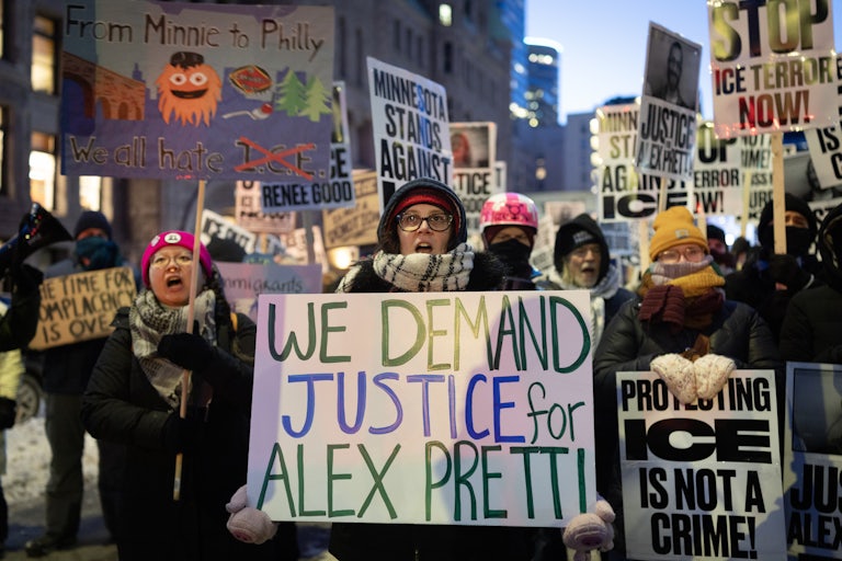 A person holds a sign that says, "We demand justice for Alex Pretti" during a protest in Minneapolis against ICE's presence in Minnesota