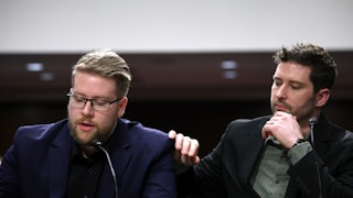 Brent Grancer places his hand on Luke Granger's shoulder as he speaks.