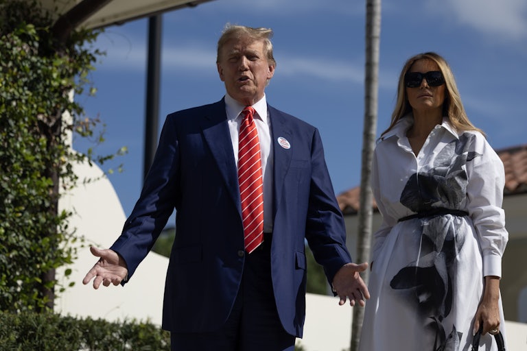 Donald Trump and Melania Trump stand next to each other