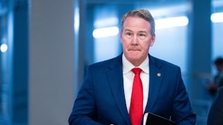 Ohio Senator Jon Husted walks in the Capitol