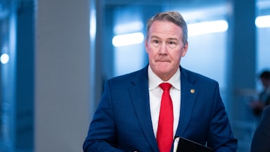 Ohio Senator Jon Husted walks in the Capitol