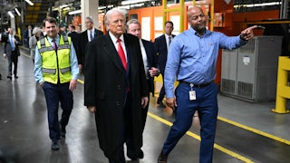President Donald Trump tours a Ford plant along with three other men.