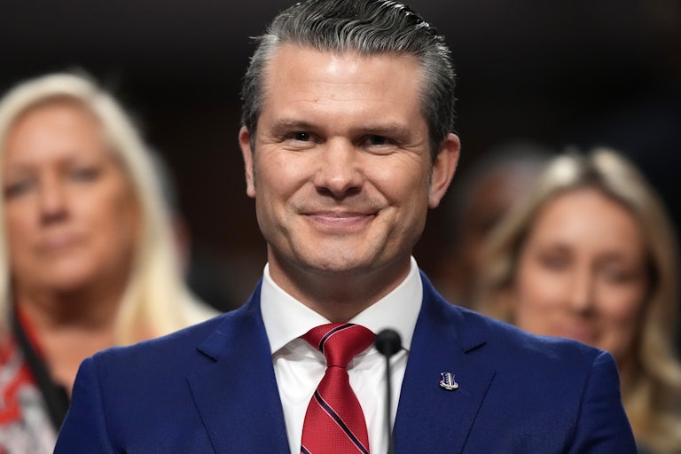 Donald Trump’s nominee for defense secretary Pete Hegseth smiles in his confirmation hearing