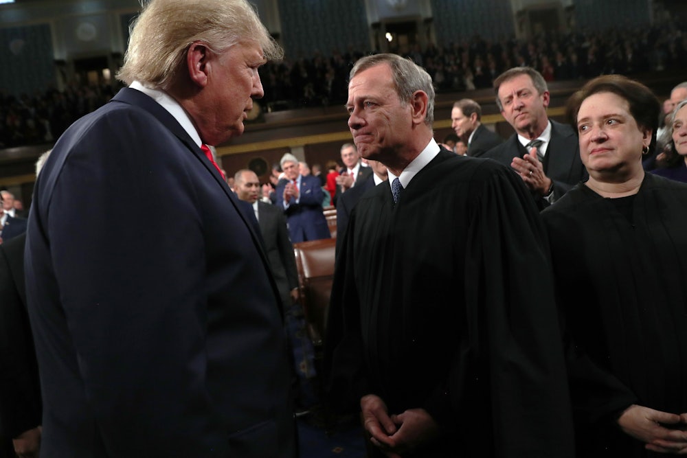 Trump with Supreme Court Chief Justice John Roberts at the State of the Union address
