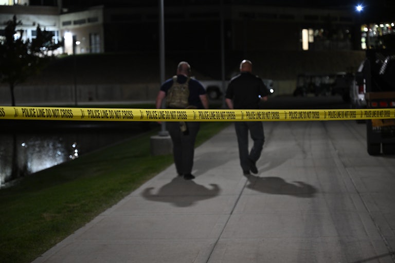 Law enforcement officers walk on the Utah Valley University campus, where Charlie Kirk was shot dead