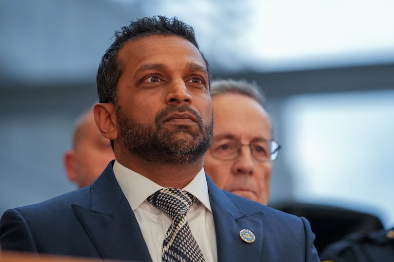 FBI Director Kash Patel stands during a press conference