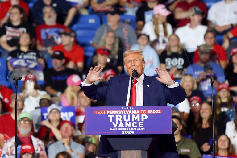 Donald Trump gestures while speaking at a campaign rally