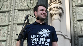 Palestinian activist Mahmoud Khalil wears a shirt that says "Lift the Siege on Gaza."