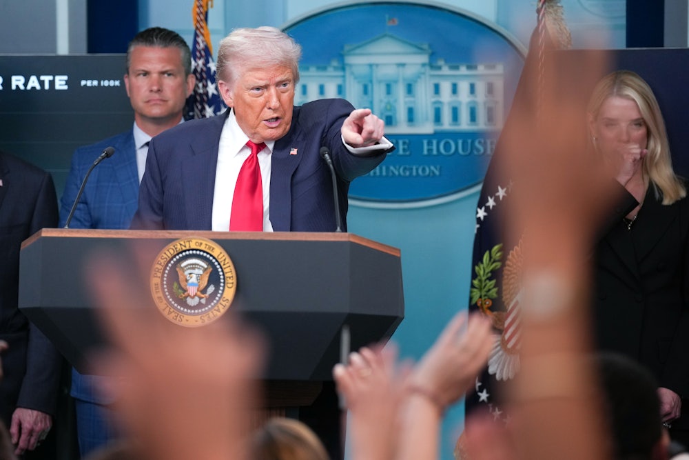 Donald Trump answers questions during a press conference in the White House.
