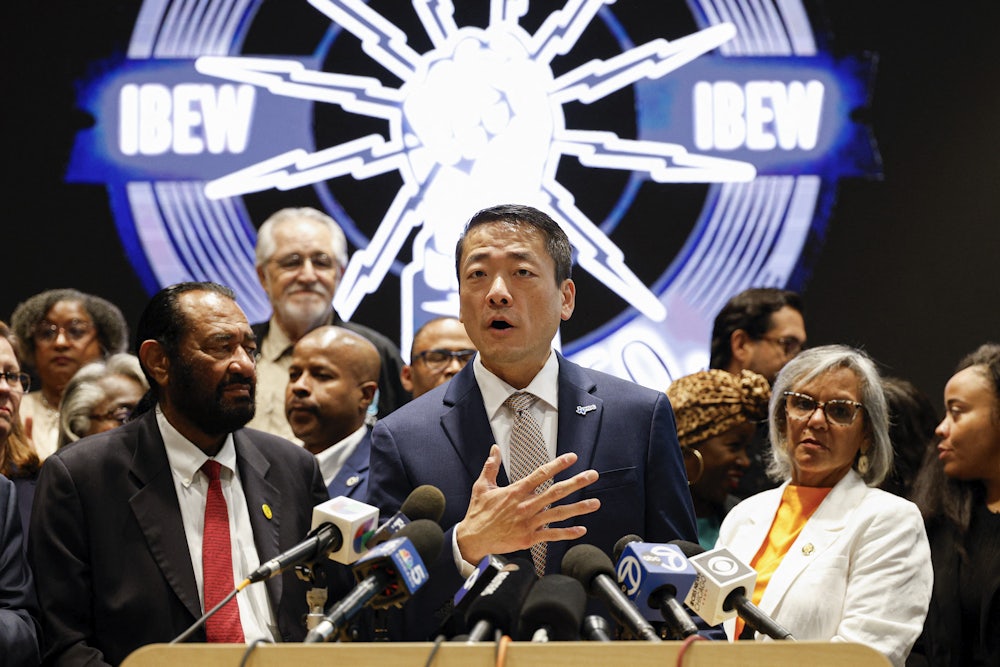Texas Representative Gene Wu speaks in front of Democratic members of Congress and Texas House Democrats during a news conference, after they left their state to deny Republicans the quorum needed to redraw the state’s 38 congressional districts.