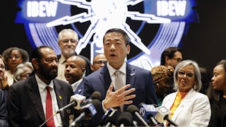 Texas Representative Gene Wu speaks in front of Democratic members of Congress and Texas House Democrats during a news conference, after they left their state to deny Republicans the quorum needed to redraw the state’s 38 congressional districts.
